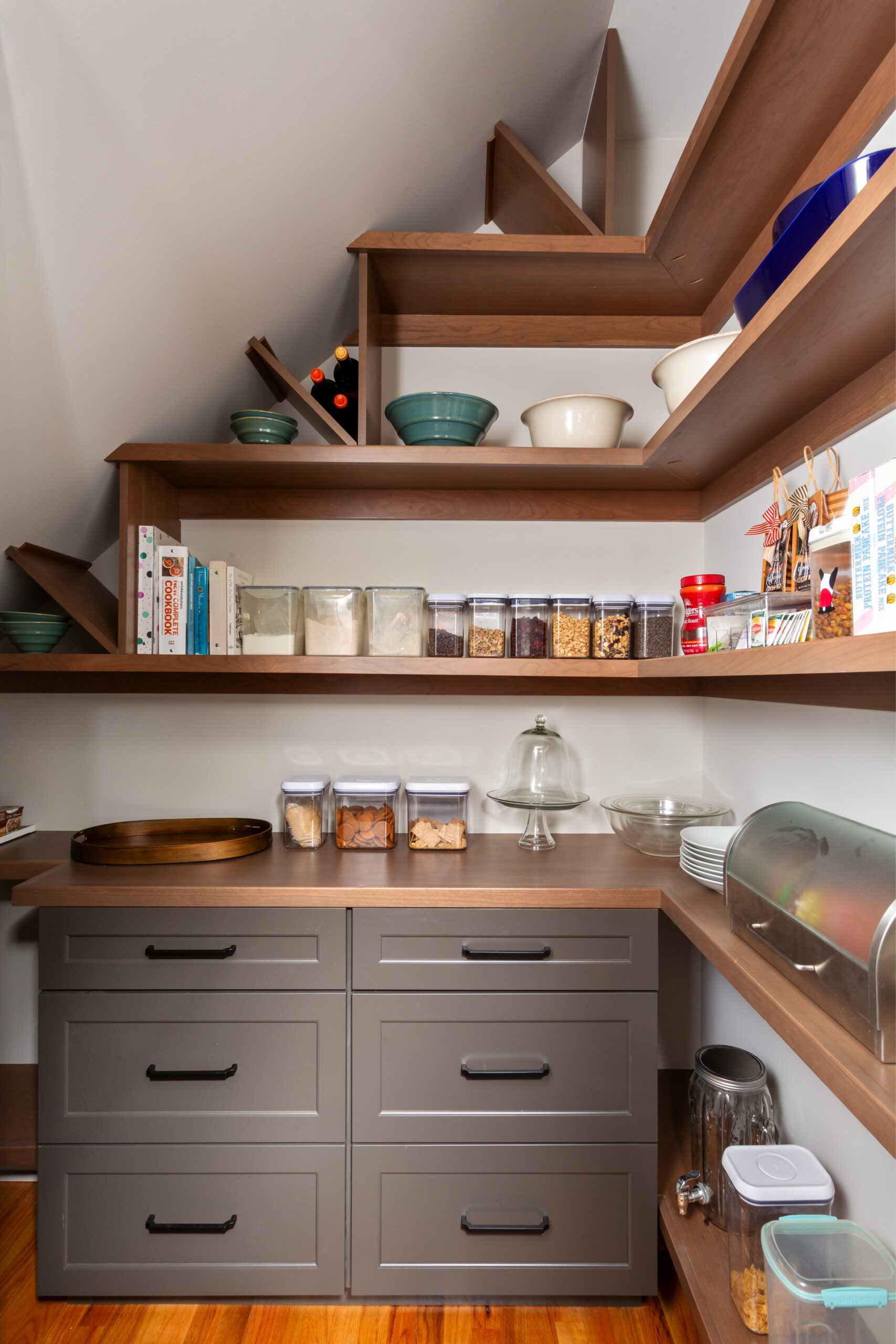 Custom walk-in pantry with wood shelving, built-in drawers, and organized storage in Niskayuna kitchen remodel.